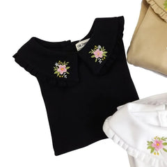 Polo Negro con Flor Bordada - Compostura